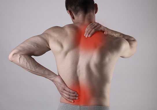 man with upper and lower back pain
